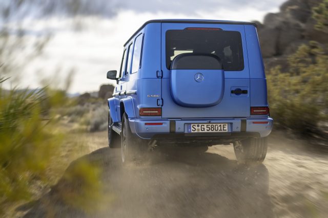 A mercedes G-wagon drives away from the camera