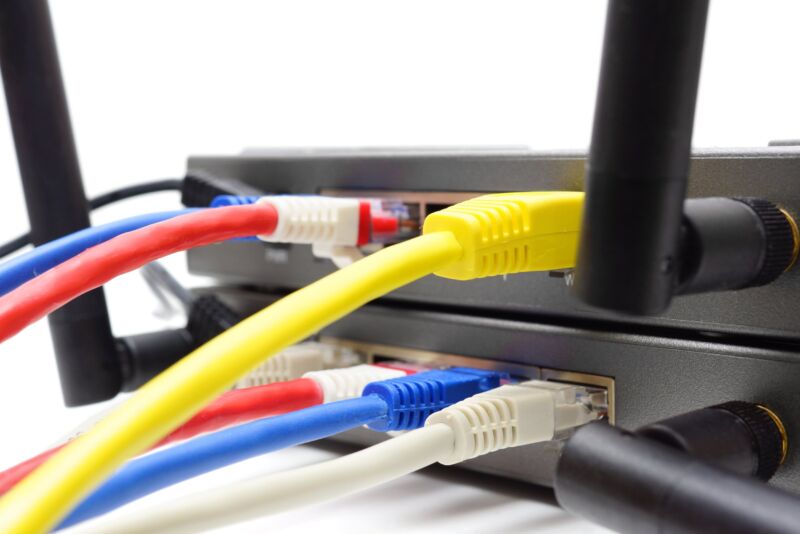 Ethernet cables connected to the ports in a wireless router