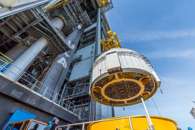 The "doghouse" structures around the circumference of Boeing's Starliner spacecraft are visible in this image taken last month as the capsule was lifted on top of its Atlas V rocket. Each doghouse has multiple thrusters.