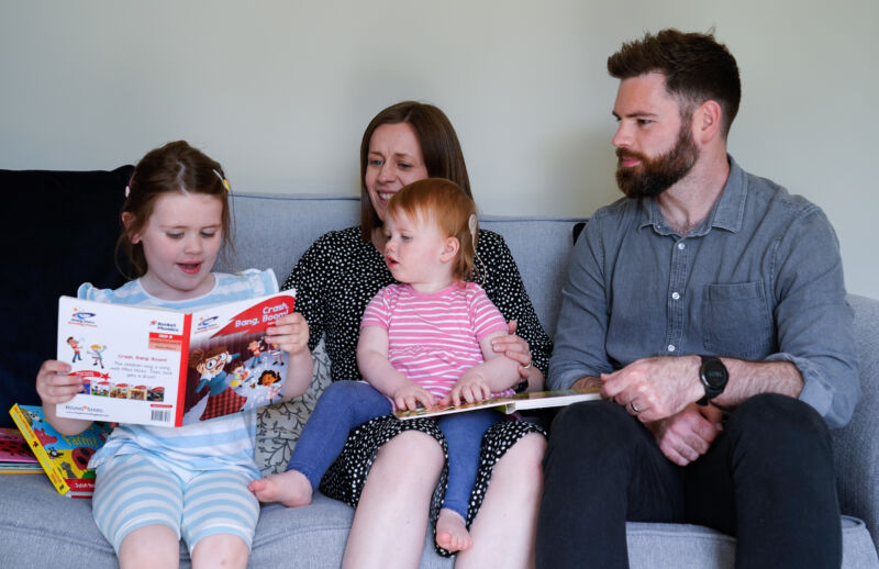 Opal Sandy (center), who was born completely deaf because of a rare genetic condition, can now hear unaided for the first time after receiving gene therapy at 11-months-old. She is shown with her mother, father, and sister at their home in Eynsham, Oxfordshire, on May 7, 2024.