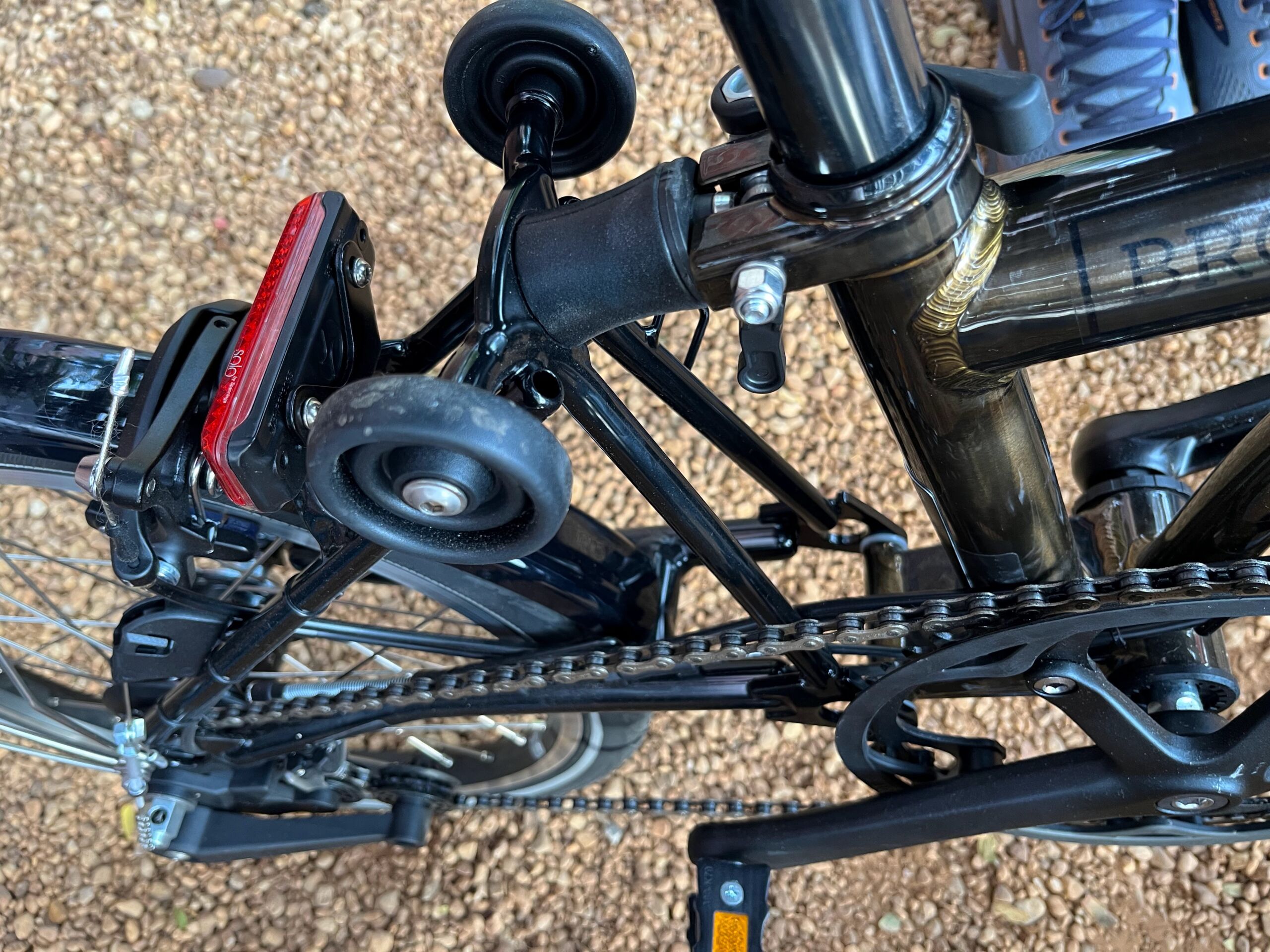 The roller wheels on a Brompton and some detail on how much small-space engineering is built into the bike.