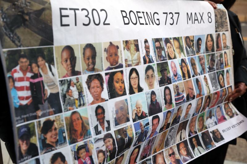 Relatives hold a poster with faces of the victims of Ethiopia flight 302 outside a courthouse in Fort Worth, Texas, on January 26, 2023.