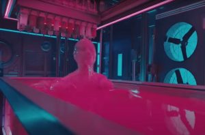 A figure rises from a tub of hot pink primordial glue