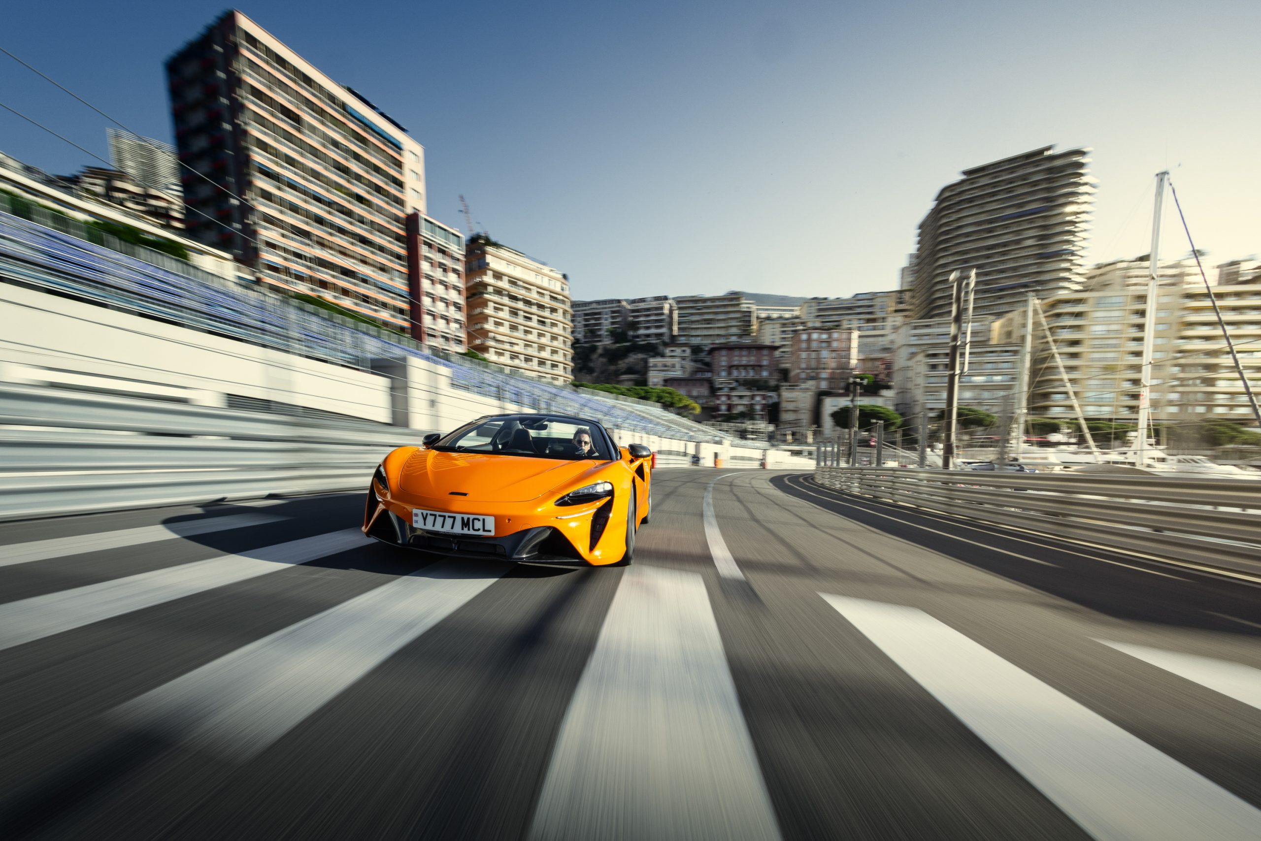 A McLaren Artura drives down a section of the Monaco GP circuit