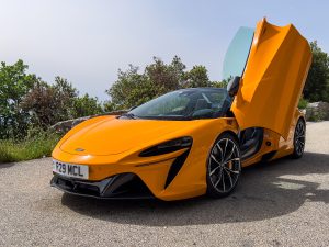 A McLaren Artura Spider with the driver's door open