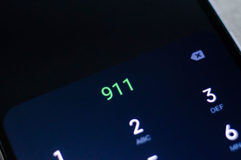 Emergency number 911 inputted on a cell phone dialing screen.