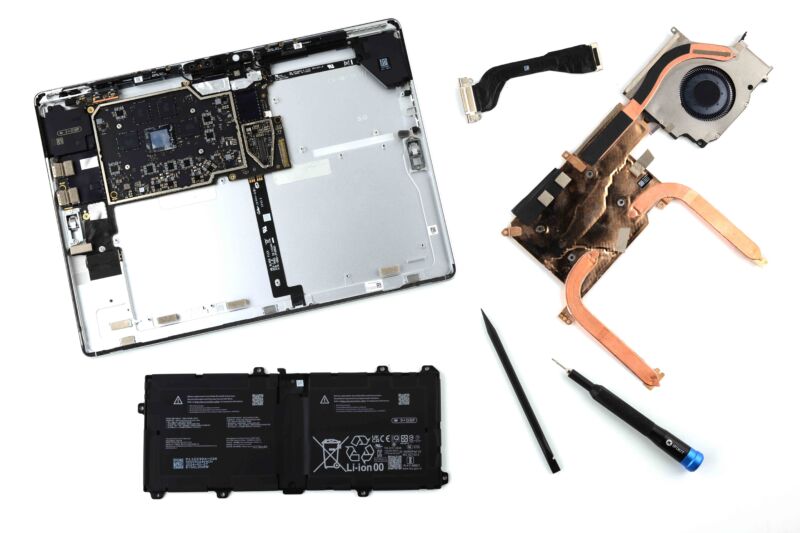 Microsoft's 11th-edition Surface Pro, as exploded by iFixit. Despite adhesive holding in the screen and the fact that you need to remove the heatsink to get at the battery, it's still much more repairable than past Surfaces or competing tablets.