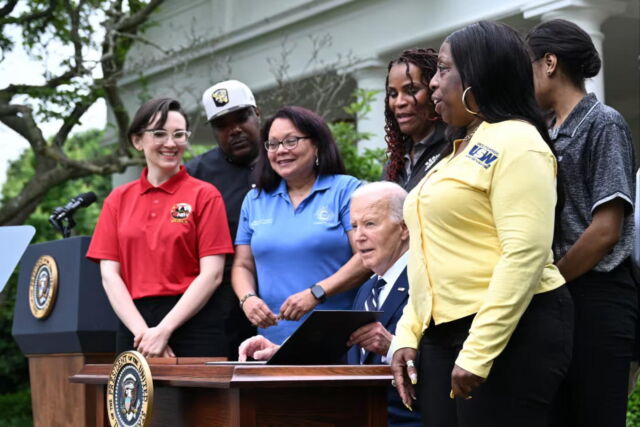 Joe Biden with union members last month as the president approved a rise in tariffs on Chinese-made goods, including a quadrupling of the levies imposed on imported EVs. 