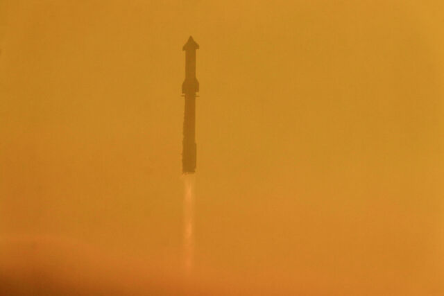 SpaceX's Super Heavy booster and Starship rocket climb through a hazy sky over South Texas.