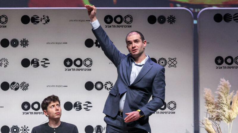 Illya Sutskever gestures as OpenAI CEO Sam Altman looks on at Tel Aviv University on June 5, 2023.