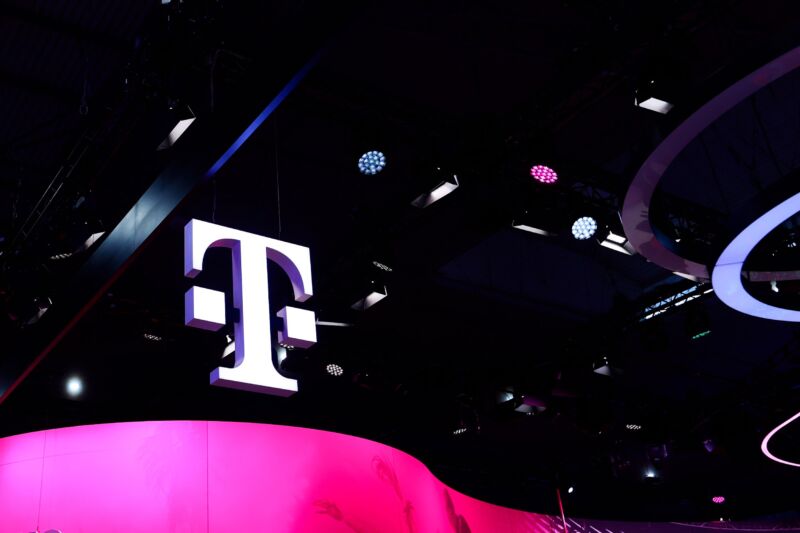A large T-Mobile logo above a conference hall.
