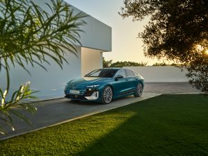 Audi S6 Sportback e-tron parked next to a balearic house