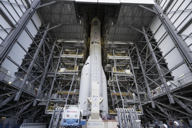 The first Ariane 6 rocket is pictured inside the mobile gantry on its launch pad in Kourou, French Guiana. The gantry will wheel away from the rocket during the countdown Tuesday.