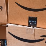 A close-up of several Amazon-branded boxes in a stacked pile