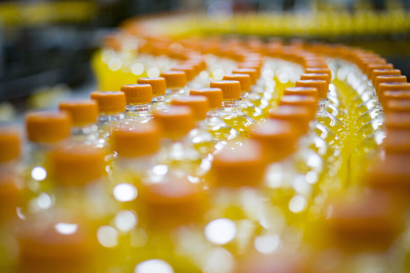 Tops of citrus sodas at a manufacturing plant.