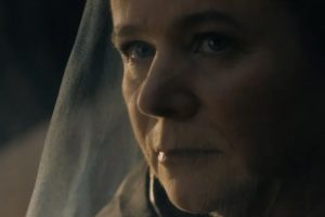 closeup of veiled middle aged woman looking determined