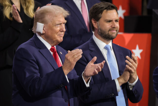Republican presidential candidate former US President Donald Trump (L) and Republican vice presidential candidate US Sen. J.D. Vance (R-Ohio) appear on the first day of the Republican National Convention at the Fiserv Forum on July 15, 2024, in Milwaukee, Wisconsin.