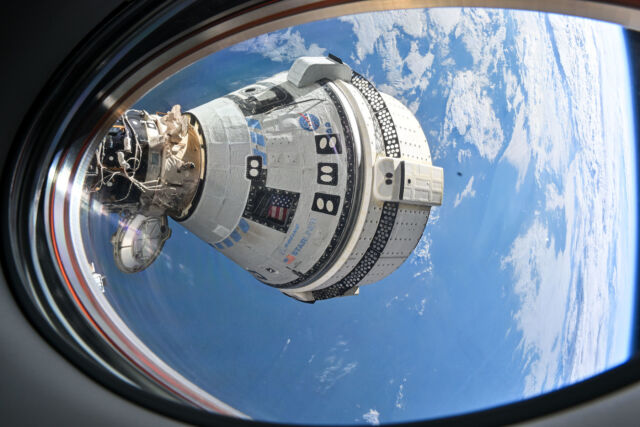 From the window of SpaceX's Dragon spacecraft, the Boeing Starliner spacecraft can be seen docked at the International Space Station.