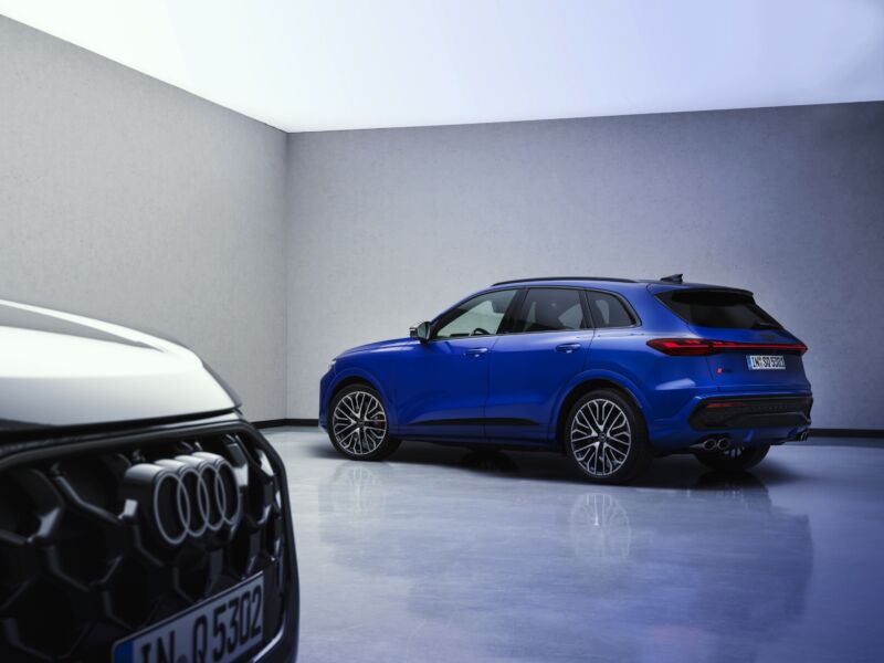 A blue Audi SQ5 and a black Audi Q5 seen in a studio