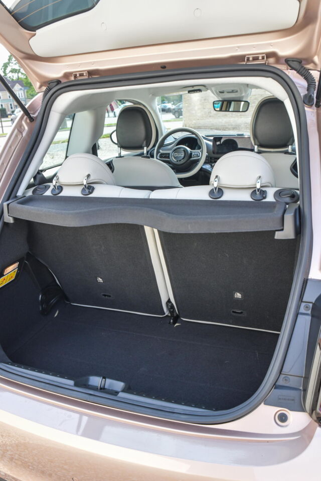 There's about 7.5 cubic feet of storage space with the backseat in place. Unfortunately, the seats don't fold flat.