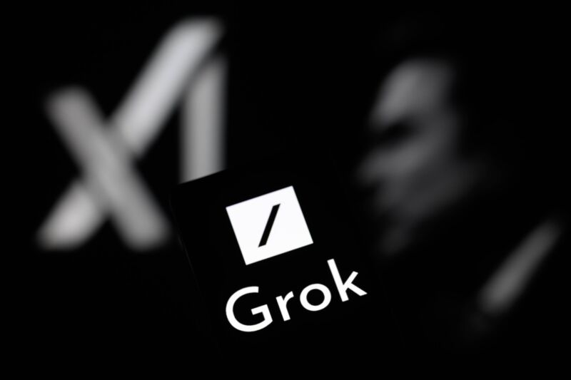 The logo for X's Grok AI tool displayed on a smartphone with an xAI icon and a picture of Elon Musk visible in the background.