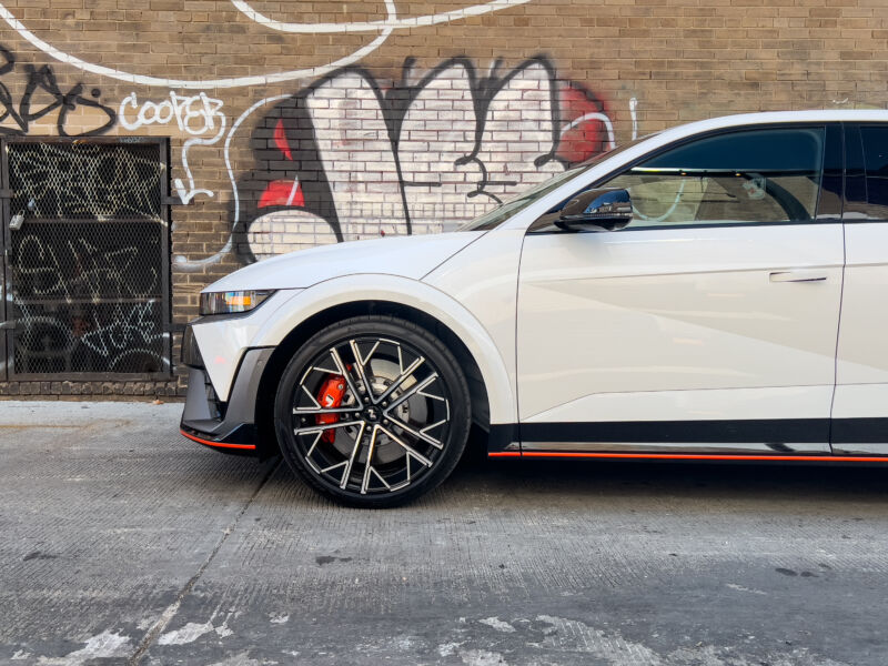 The front half of a white Ioniq 5 N in an alleyway