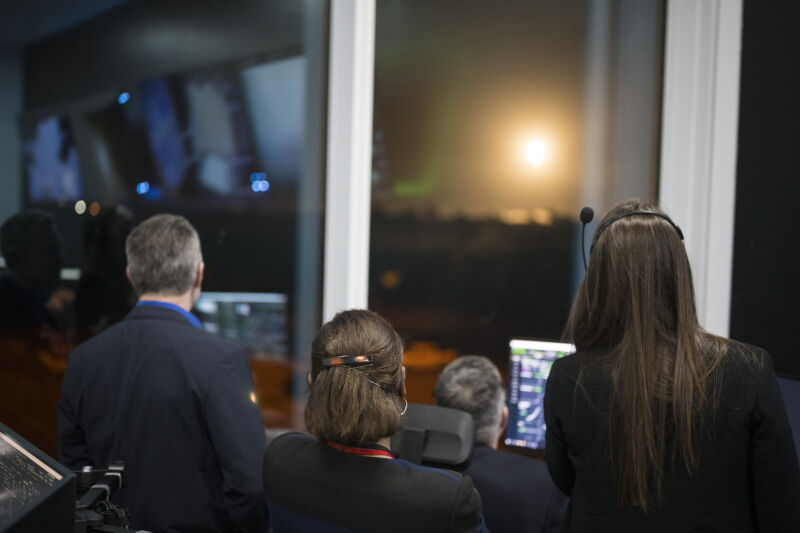 NASA officials inside SpaceX's launch control center at Hangar X watch the liftoff of a Falcon 9 rocket a few miles away on March 3, 2024.