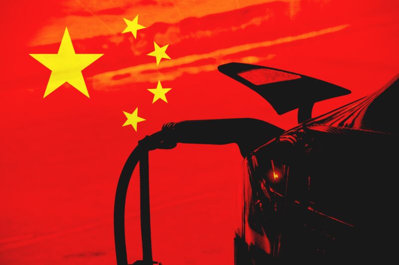 Close up view of a car on charge with the Chinese flag as background. Concept of electric cars in China or Chinese car industry.