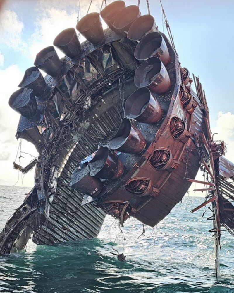 A salvage ship raises a portion of SpaceX's Super Heavy booster from the Gulf of Mexico. This booster was used on the most recent Starship test flight in June.