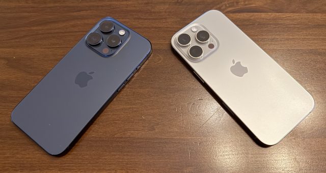 Two titanium iPhones with triple cameras