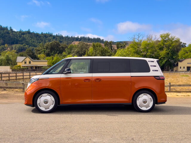 A VW ID Buzz in profile, parked in a rural village in California