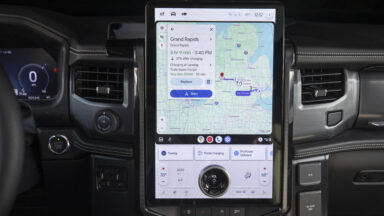 A Ford F-150 Lighting dashboard showing the infotainment system, which is displaying Google Maps being cast from Android