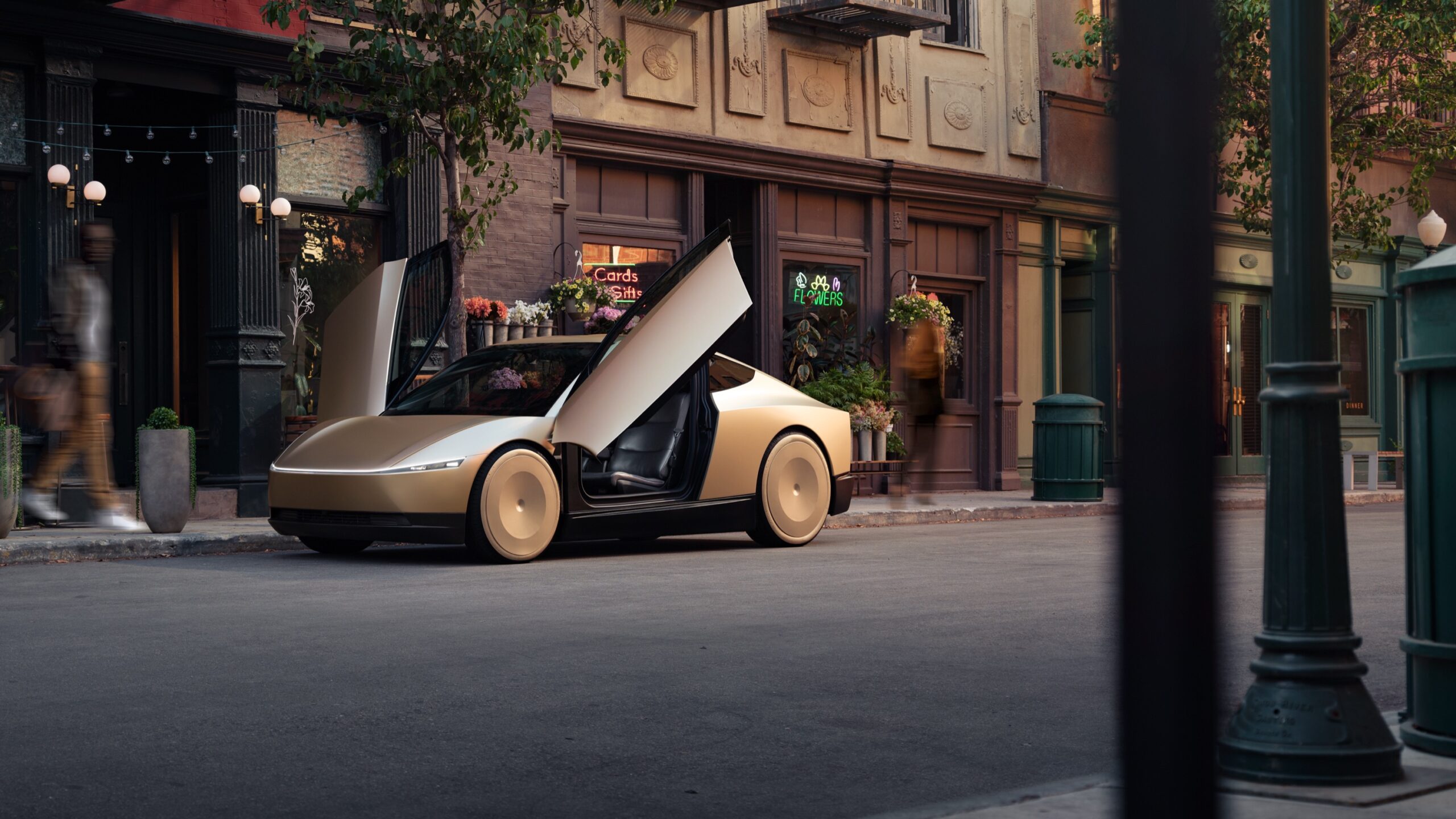 A rendering of a gold Tesla Cybercab parked outside a building