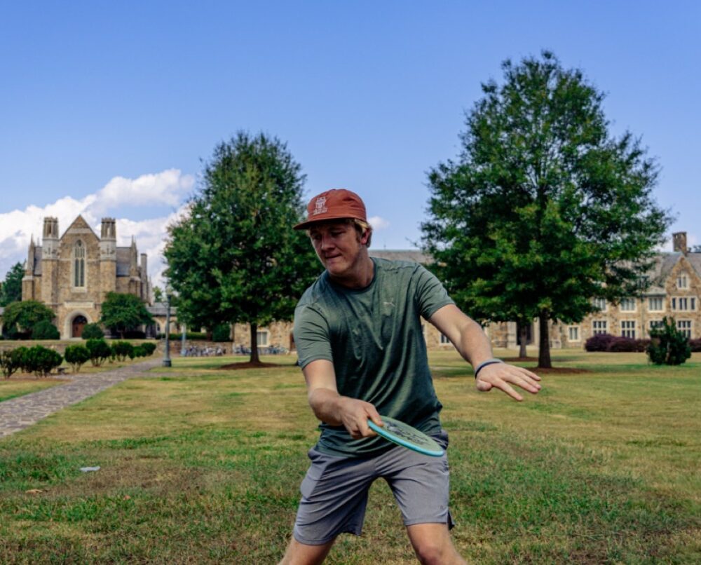 Undergraduate student, Calvin Teague, demonstrates an optimal thumb grip on a mid-range disc.