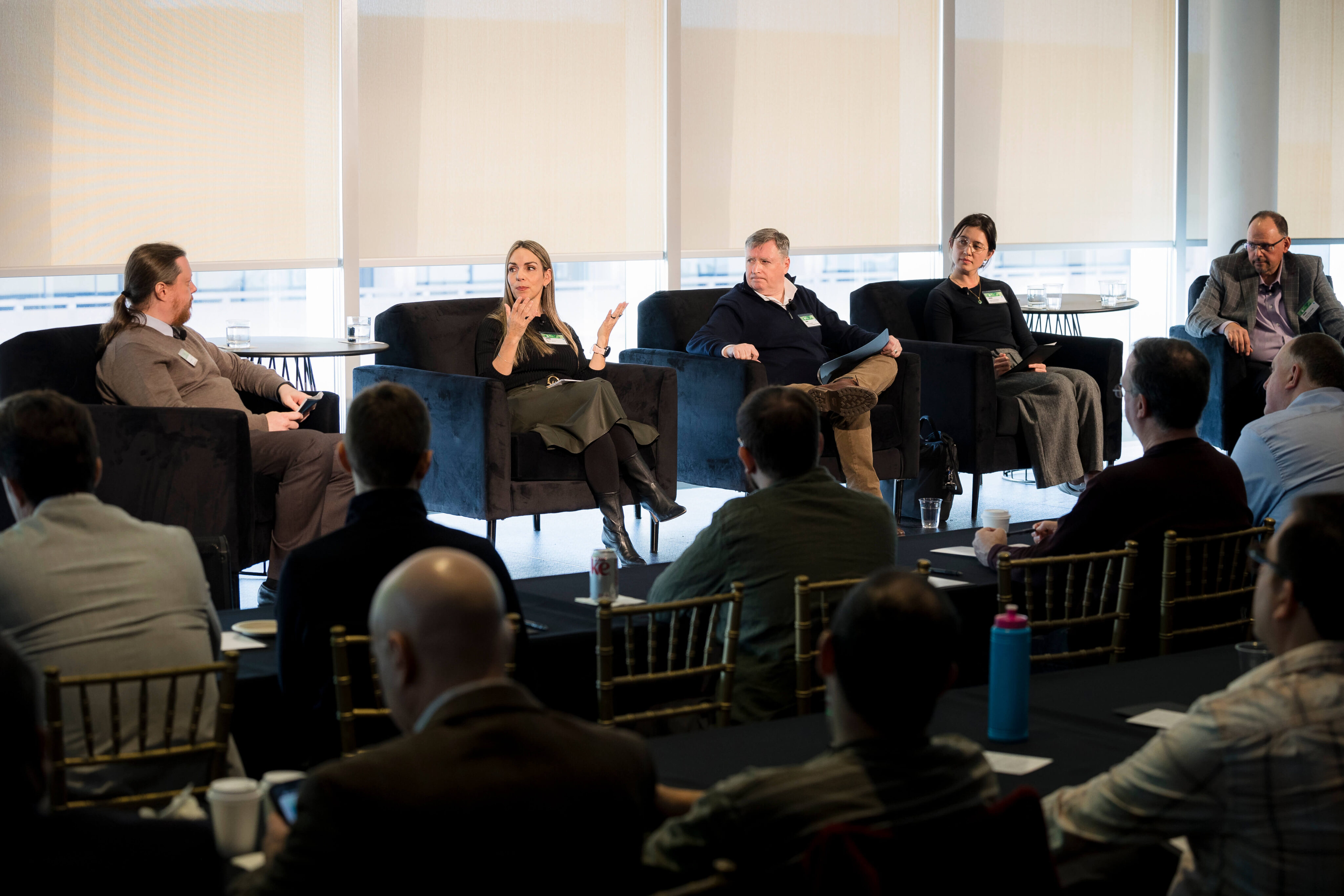 Photograph of panelists on a stage