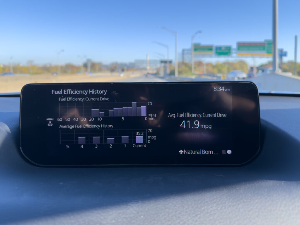 Mazda CX-50 Hybrid infotainment display showing recent mpg, that trip was 41.9 mpg