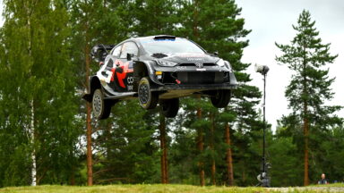 A Toyota GR Yaris rally car soars through the air during testing for Rally Finland.