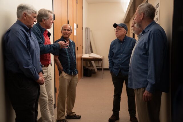 Original participants Karl Van Orsdol, Dave Eshleman, Chuck Burton, Doug Korpi, Jerry Shue, and Clay Ramsay on the recreation set in Los Angeles.