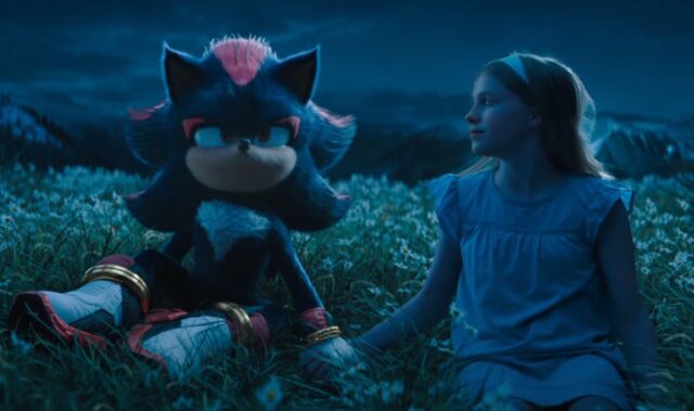 Shadow the hedgehog holding hands with a little girl in the yard.