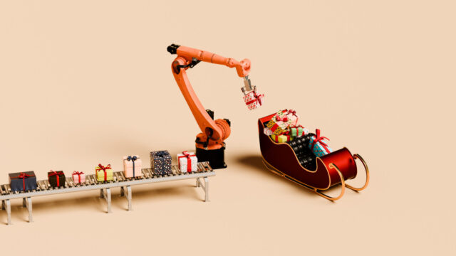 Robot arm loading sleigh with Christmas gifts from a conveyer belt - stock photo