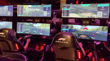 People race each other on the simulators at the Washington, DC, F1 Arcade