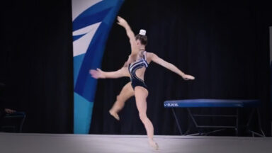 A still image from an AI-generated video of an ever-morphing synthetic gymnast.