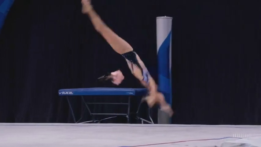 A still image from a moment where the AI-generated gymnast loses her head. It soon re-attaches to her body.