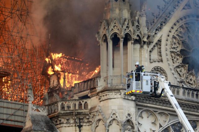 Flames and smoke billowing from the roof of Notre Dame cathedral in Paris, France, on April 15, 2019.