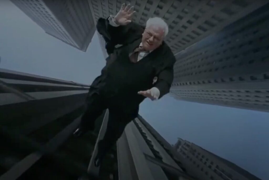 white haired man in business suit in mid air, falling from a skyscraper