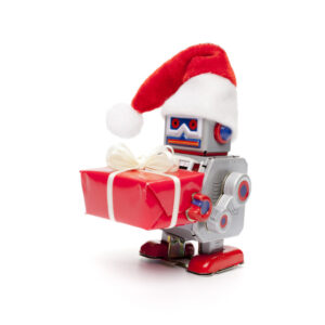 Retro tin toy santa robot holding christmas present