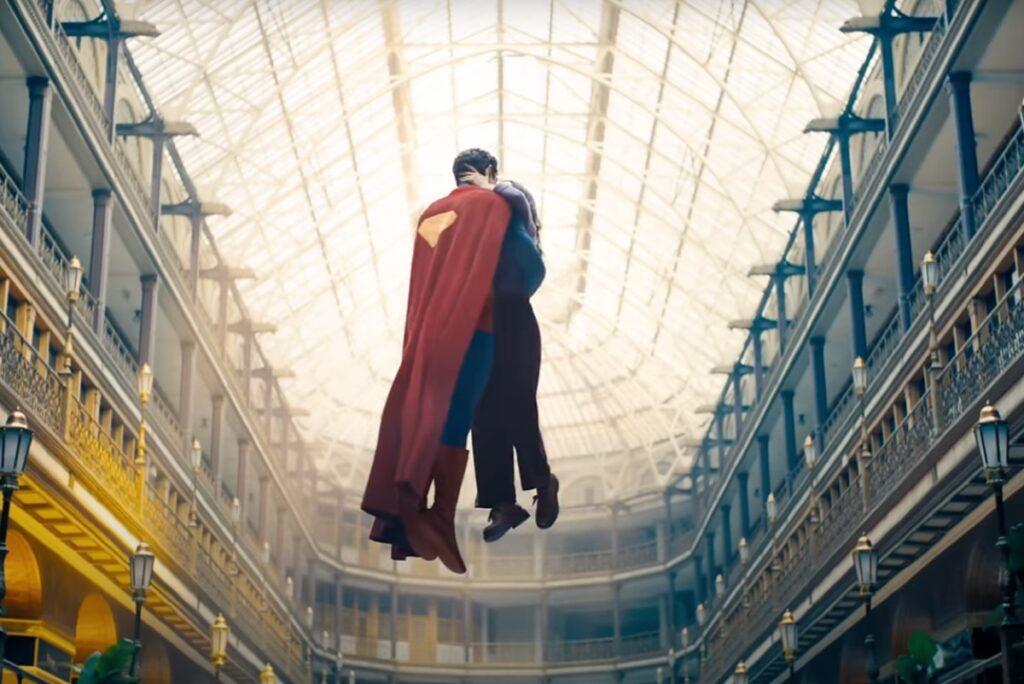 Superman embracing Lois Lane in mid air.