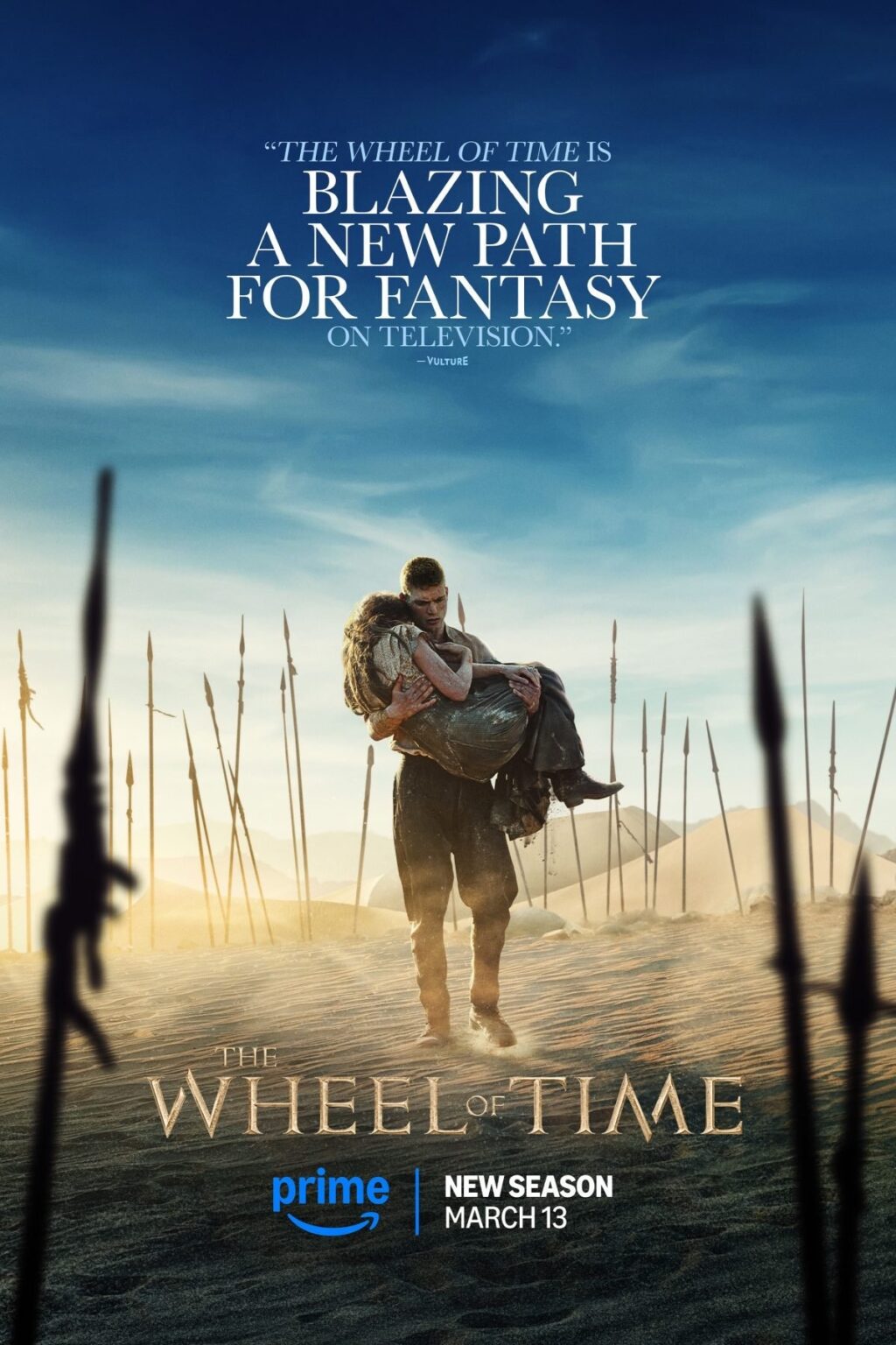 poster art showing man carrying a woman through a desolate war-torn landscape