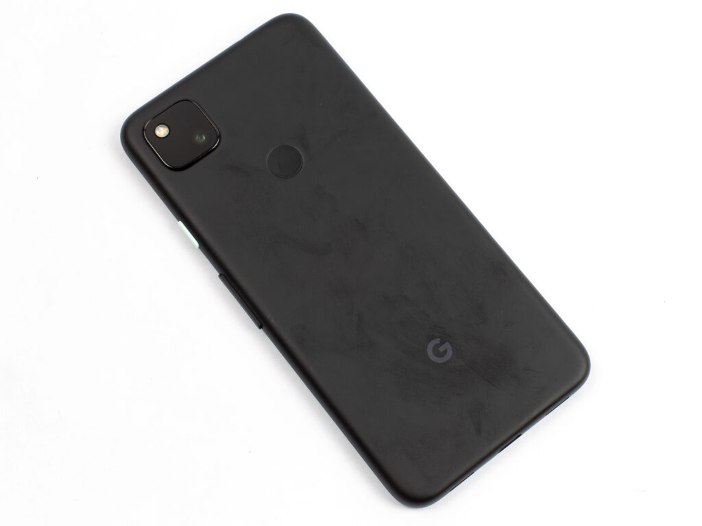 Pixel 4a, tilted, face down, with fingerprints proper thru its relief duvet.