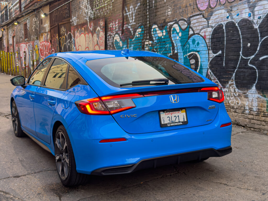 A blue Honda Civic seen from behind